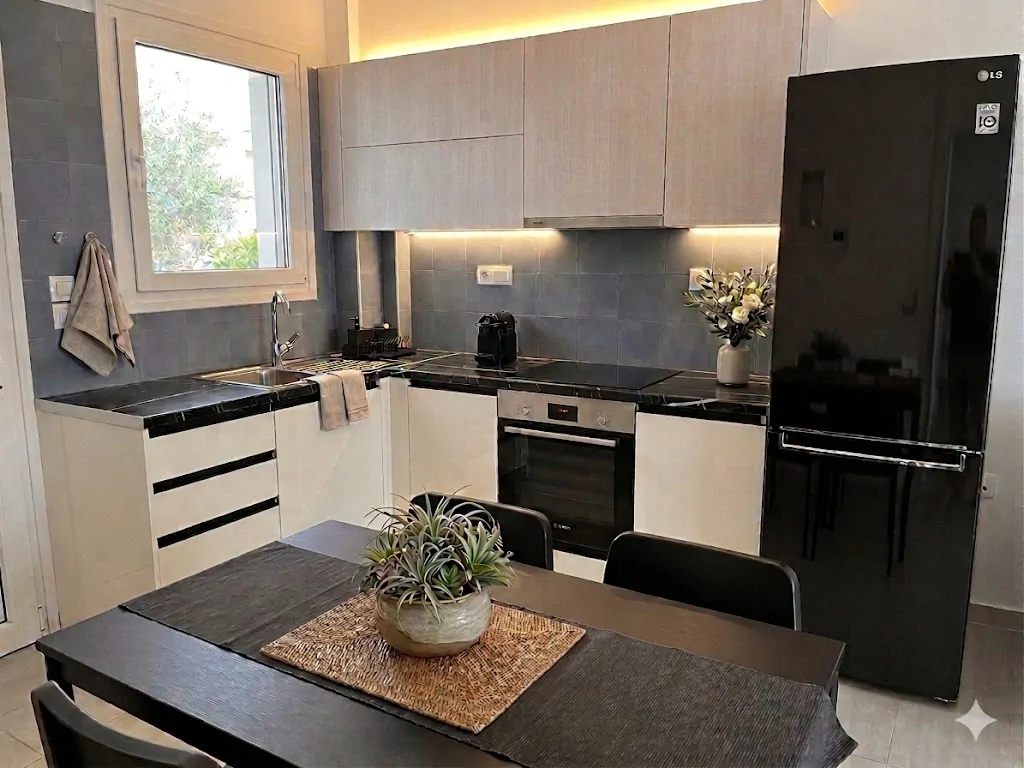 Kitchen with dark backsplash and dining